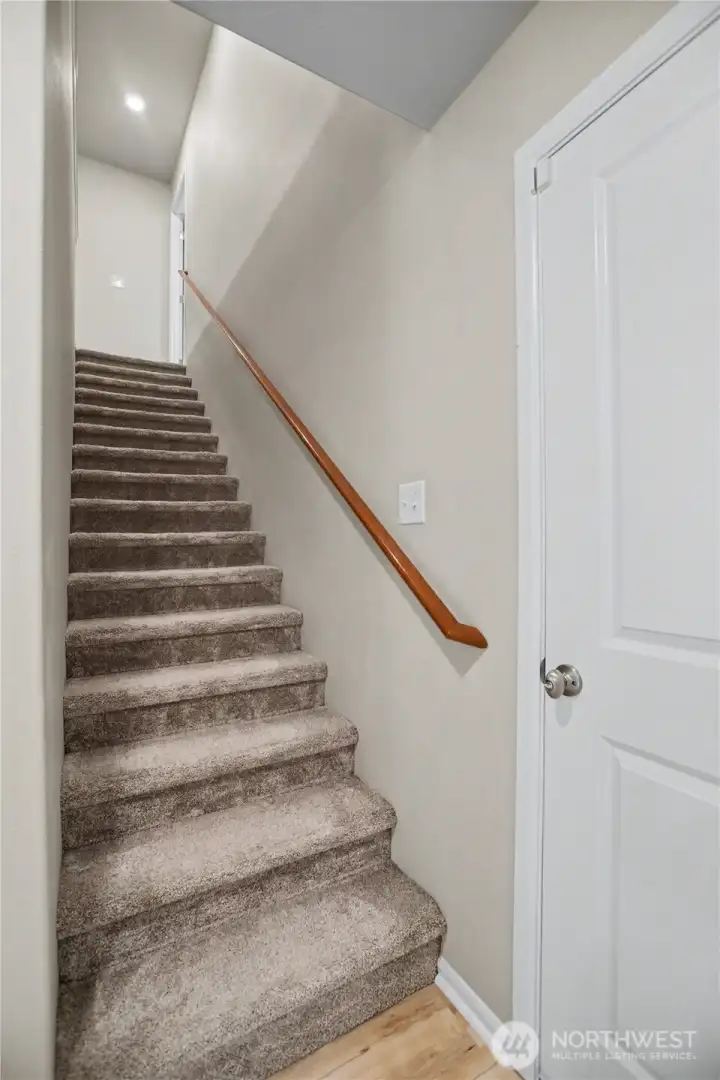 garage access door to the right, upstairs to all bedrooms