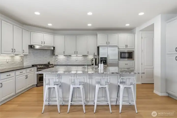 Stunning kitchen remodel with large island and eating space.