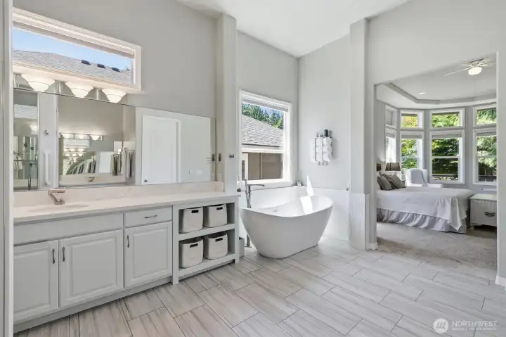 Primary bath has just been remodeled with free-standing soaking tub and heated floors.