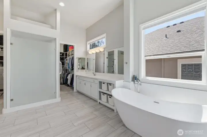 This shows the large shower and one of the two vanities.