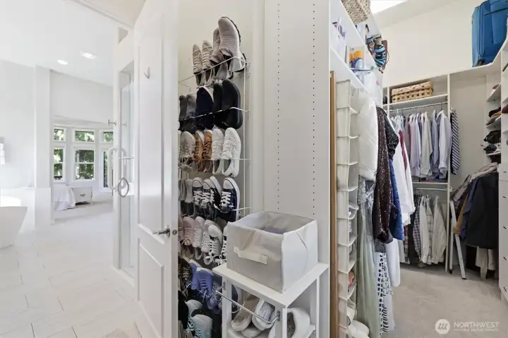 Bathroom has a large walk-through closet with plenty of space and a lot of light.