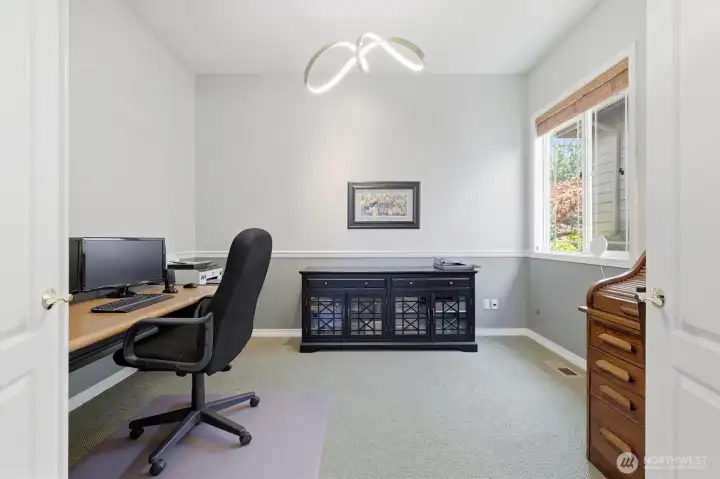 Double doors lead to office off the entry way.  There is also a second office space in the loft upstairs.