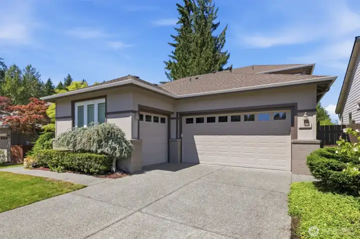 Home has a 3-car garage with electric car charging station.