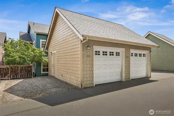 Large detached garage opens onto the alley, and  there is an additional parking space next to it.