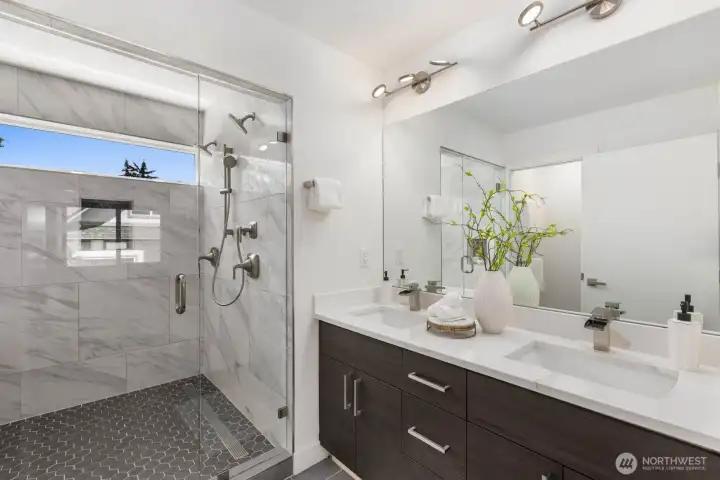 Primary bath with a dual vanity and oversized walk-in shower and large soaking tub with heated floors. Primary bath with a dual vanity and oversized walk-in shower and large soaking tub with heated floors.