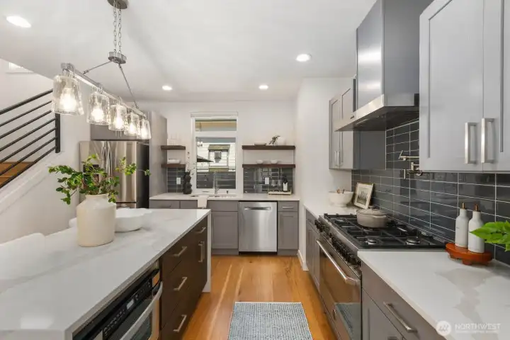Thoughtfully designed kitchen with generous counter space, storage, and prep area. Thoughtfully designed kitchen with generous counter space, storage, and prep area.