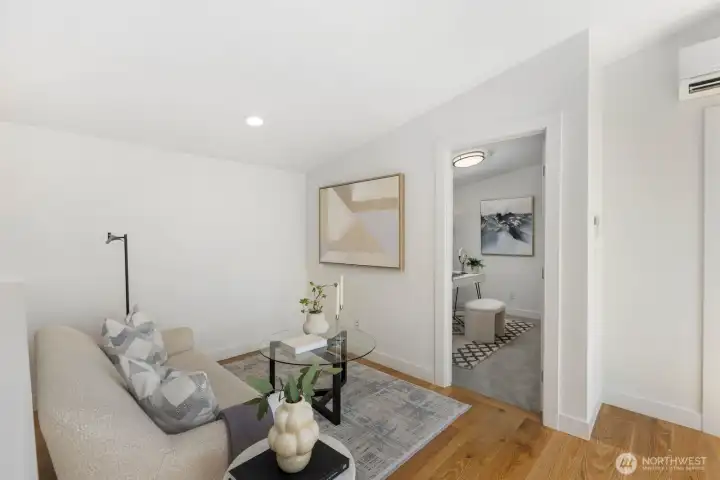 Flexible third-floor lounge with a separate bedroom or office just beyond. Flexible third-floor lounge with a separate bedroom or office just beyond.