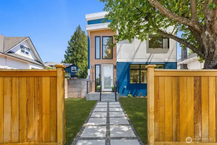 Welcoming entry path through the fully fenced front yard. Welcoming entry path through the fully fenced front yard.