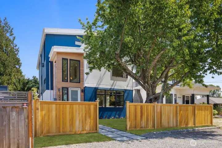 Modern architecture, mature landscaping, and a private fenced yard. Modern architecture, mature landscaping, and a private fenced yard.