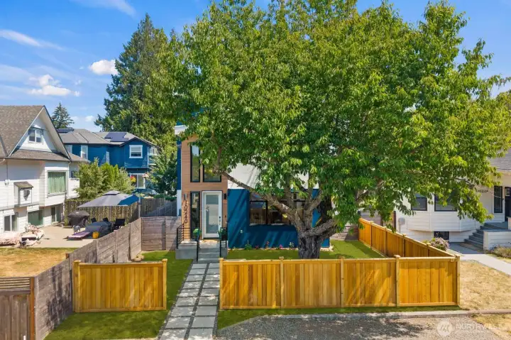 Aerial view of the fully fenced front yard and property setting. Aerial view of the fully fenced front yard and property setting.
