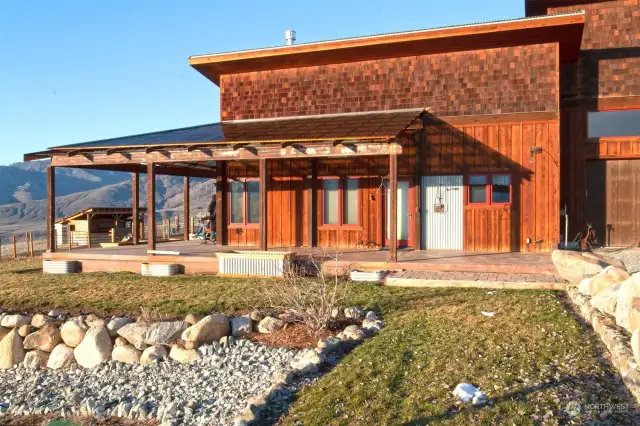This modest residence with massive garage (easily converted to additional living space) is perched high above the Methow River overlooking the Sawtooth Mountains on two 20+ acre parcels, each with it's own private domestic well.