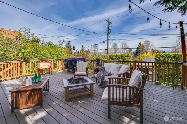 Large deck with mountain view off of kitchen and family room.