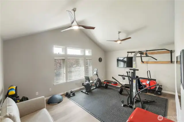 Your flex space, flexing. Bonus room with vaulted ceilings currently serving up fitness realness—but could moonlight as a playroom, studio, or theater.