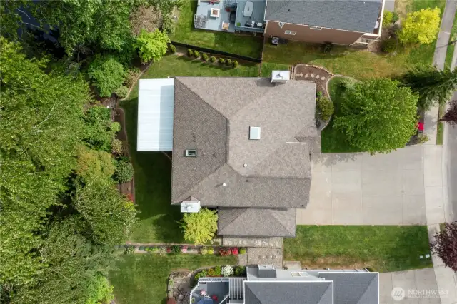 Drone drop! Showcasing that gorgeous 50-year architectural roof—because protection and curb appeal go hand in hand.