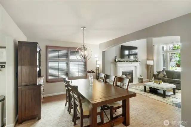 Formal Living Room – Soaring ceilings, abundant natural light, and a welcoming front entry view.