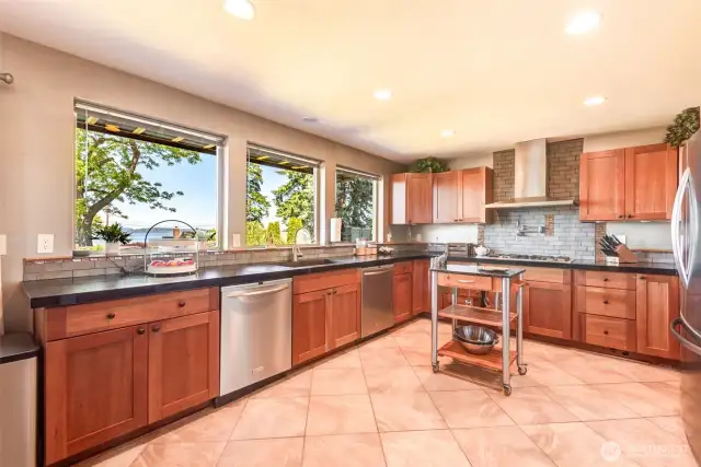 Beautiful kitchen offers wood cabinets, stainless appliances, & 2 dishwashers!