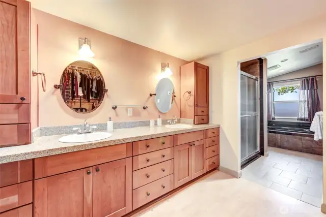 Primary bath features double sinks, walk in shower, large jetted tub, a large closet/dressing area!