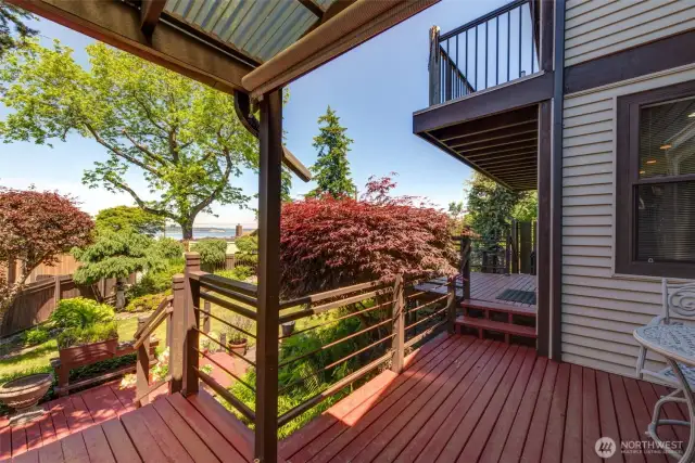 Large deck leads out to the beautiful gardens and green house!