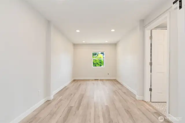 Primary suite with adjacent five piece bath.