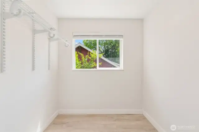 Primary suite walk-in closet with where space abounds.