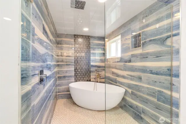 Primary bath shower and lavish soaking tub.