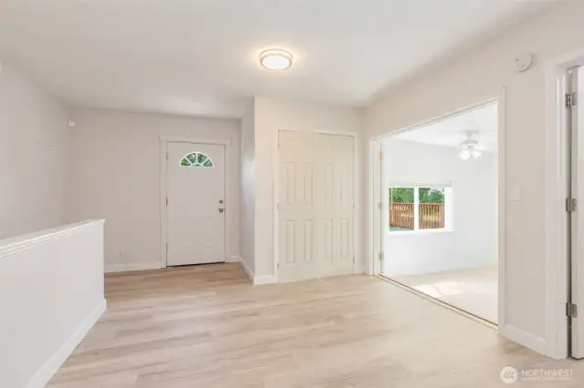 Rear door to deck and adjacent double door entry to the second bedroom.