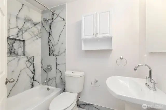 Hall bath appointed in elegance.