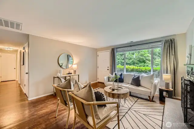 Living Room with a large window looking out to the front yard