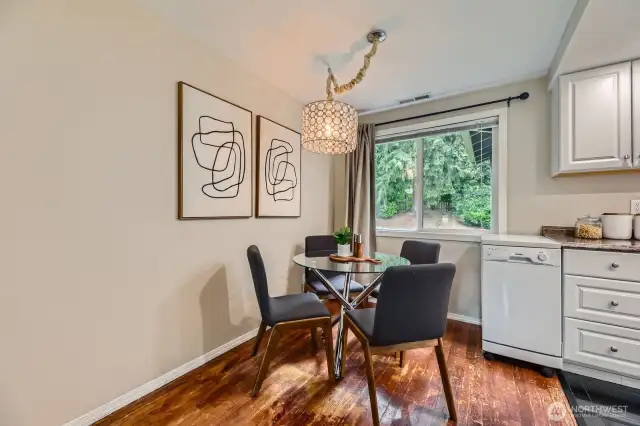 The dining room is just off the kitchen boasting a beautiful chandelier
