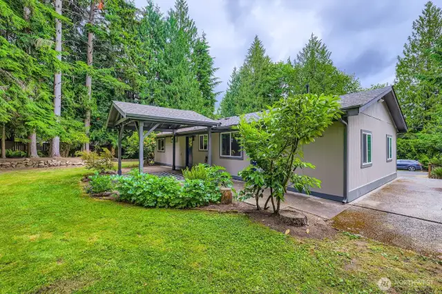 Mature landscaping frames the home.