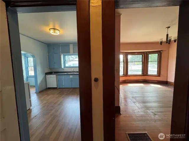 Looking from the hallway to the Dining Room and Kitchen
