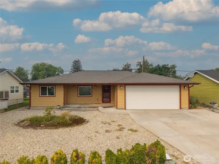 Front of home with low maintenance yard