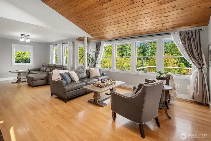 The wall of windows brings in the natural light and beautiful outdoors.