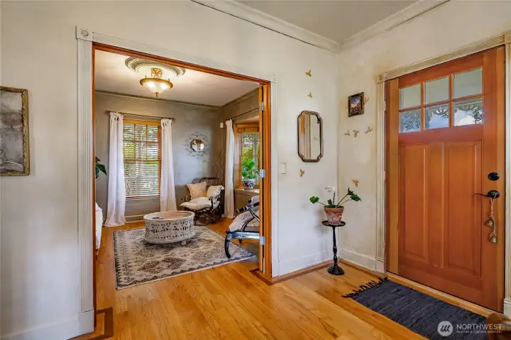 Entry. Living room in the background could be a large office/den