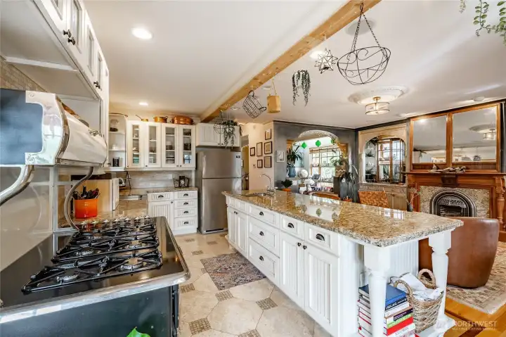 Large open kitchen. background archway leads to the front of the home.