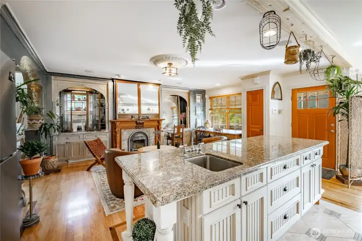 Kitchen into the family room. Left goes to the front of the house and the door to the right goes to the back yard and covered deck.