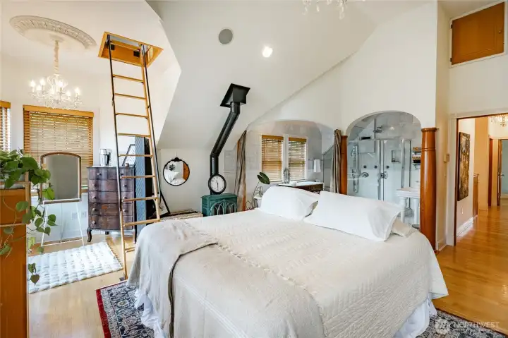 Large Primary suite with attached full bathroom and stairs leading to the 3rd floor nook. Gas freestanding gas stove for that added warmth. Light and bright and south facing.