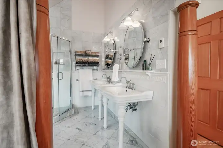 Primary bathroom with double vanities, shower and bath.
