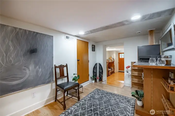 Downstairs. Looking toward the back of the home.down the stairs and to the right will be the Lower level Primary suite or '2nd Primary suite' Stairs from the main floor ar behind and to the right. There is a storage room behind as well. Lots of space.