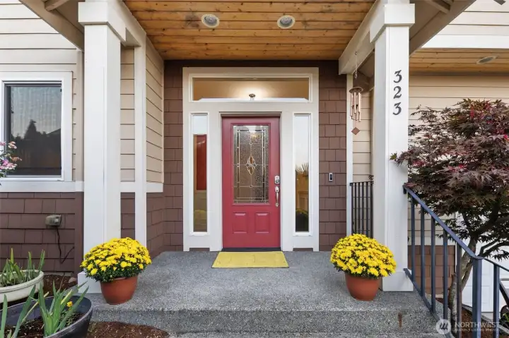 Inviting front entry with covered porch and charming details