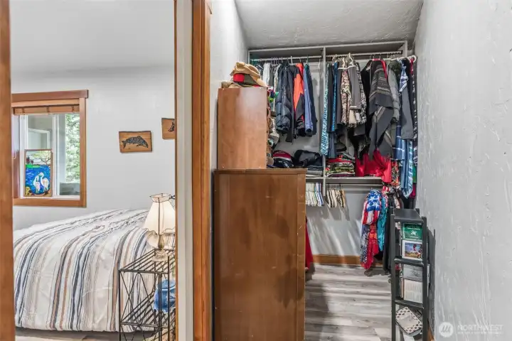 downstairs bedroom with adjacent closet space