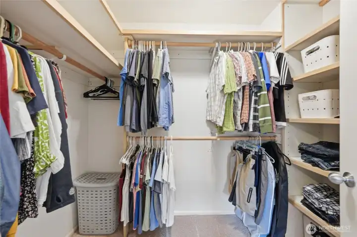 Large walk in closet with custom build in shelves for so much storage