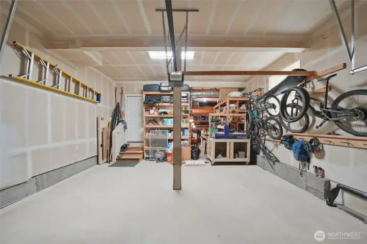 Large 2 car garage with deep storage or shop space