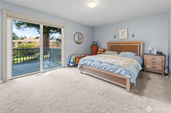 primary bedroom features a slider to deck