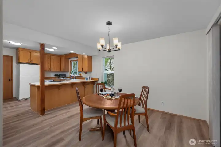 Dining room with the back sliding door taking you on to the covered deck. Dining room with the back sliding door taking you on to the covered deck.