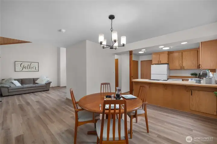 Dining room looking towards the kitchen on the right and great room on the left Dining room looking towards the kitchen on the right and great room on the left