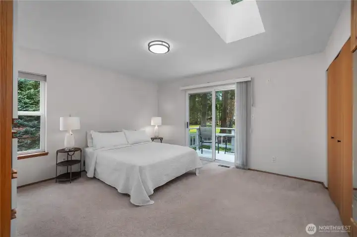 Primary bedroom with private balcony looking to the lake view and over golf course. Primary bedroom with private balcony looking to the lake view and over golf course.