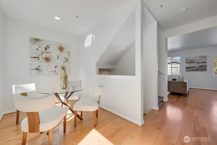 Charming breakfast nook sits just off the kitchen, offering a bright and airy spot for casual dining. Framed by soft natural light and a clean, contemporary design, the space features a stylish dining area that flows effortlessly toward the private backyard. It’s the perfect everyday gathering place, blending comfort, function, and an inviting connection to the outdoors.