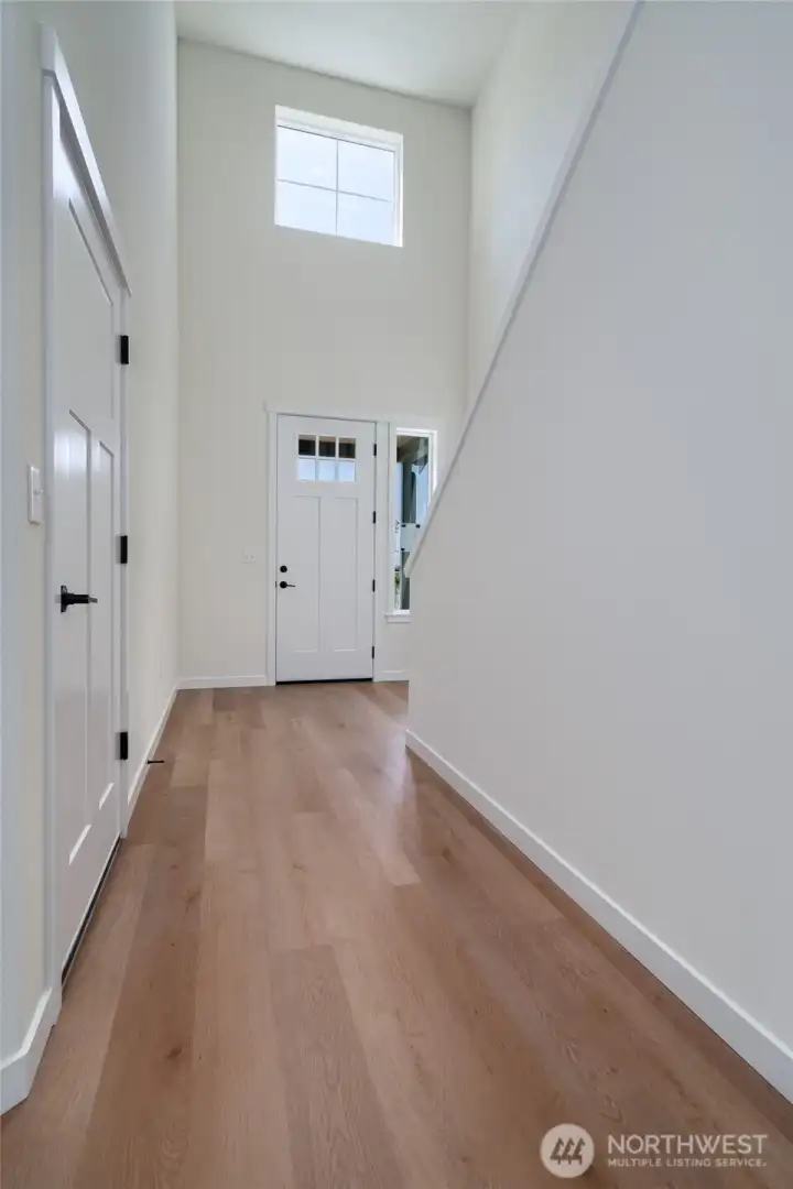 Grand entrance with tall ceilings and an abundance of light!  Pics are of a different 2601 Hattie plan home. Features and colors may differ.
