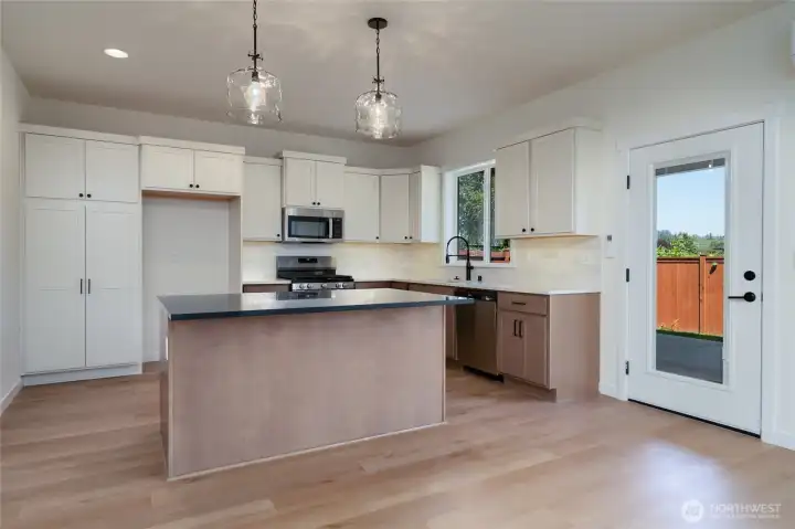 Kitchen -  Pics are of a different 2601 Hattie plan home. Features and colors may differ.